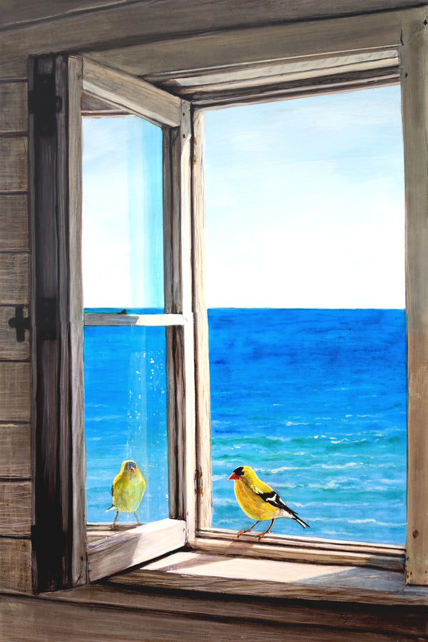 Two yellow birds perched on a wooden window sill with a view of the ocean.