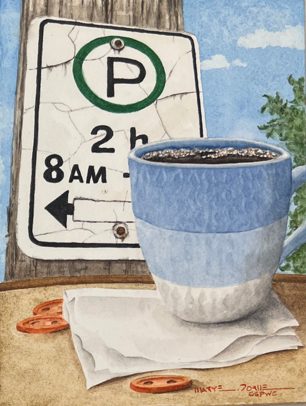 Blue and white mug with coffee next to a parking sign on a wooden surface.