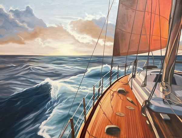 Sailing boat on choppy waters with clouds in the background