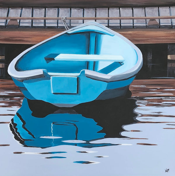 Blue boat floating on water with a dock in the background