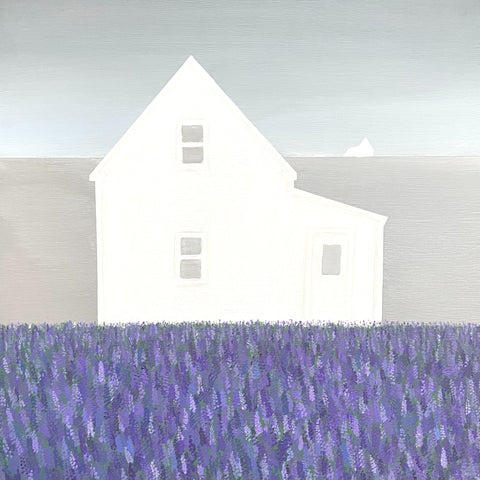 White house with a purple field in the foreground