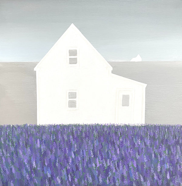 White house with a purple field in the foreground
