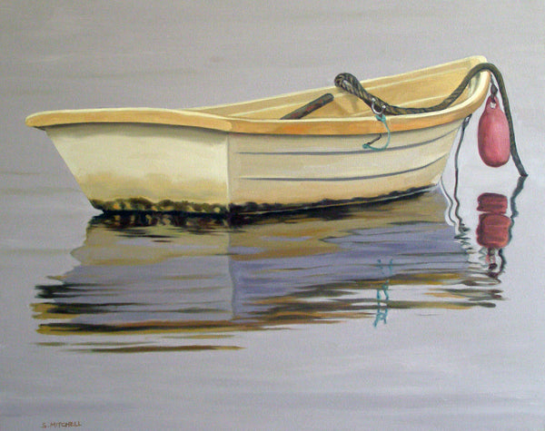 Beige rowboat with a red buoy on calm water