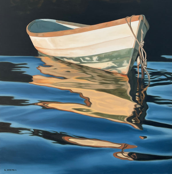 White rowboat reflected in calm water with a dark background