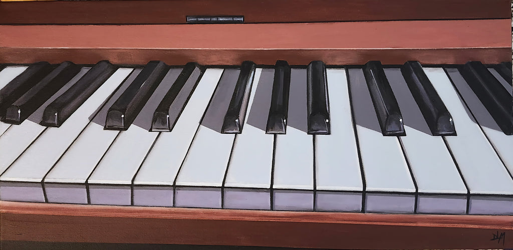 Close-up of a piano keyboard with wooden frame