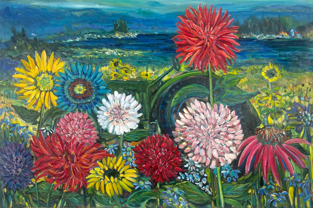 Colorful flowers in a field with a scenic background
