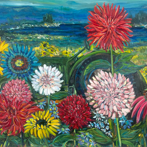 Colorful flowers in a field with a scenic background
