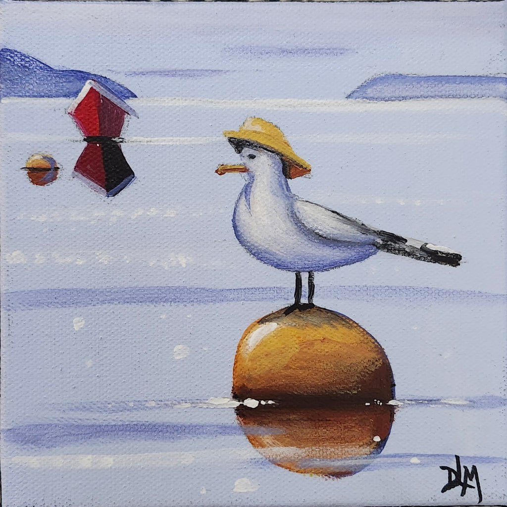 Seagull with a hat on a buoy in water with small boats in the background