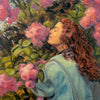 An impressionistic painting of a woman with curly reddish-brown hair leaning against pink flowers and green leaves, wearing a pale blue-green top. The artwork fills the frame, with visible brushstrokes and a signature in the lower right corner.