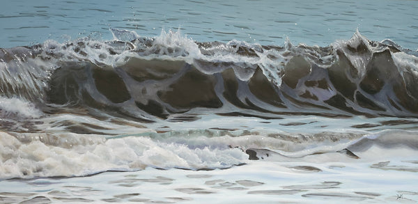 Close-up of ocean waves with white foam on a blue water background